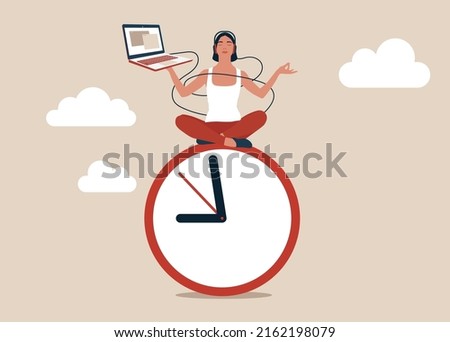 Young woman working with laptop while doing yoga or meditation on clock face. Flexible working hours, work life balance or focus and time management while working from home concept.