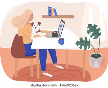 Young woman working on laptop with cute pet dog at home.