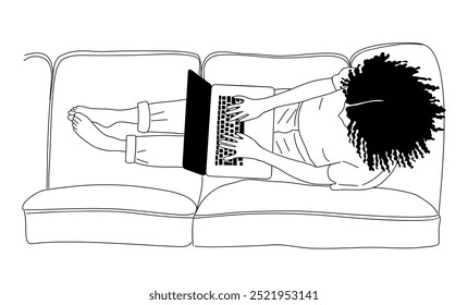 Young woman working on laptop lying on the sofa.
