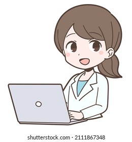 Young woman working with a pc in a white coat