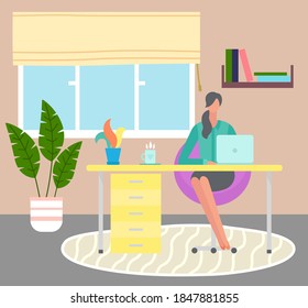 Young woman works on laptop remotely. Distance job. Self-organization and time management. Interior home design, homeplant on floor. Book shelf. Stay home and be safe. Coronavirus self-isolation.