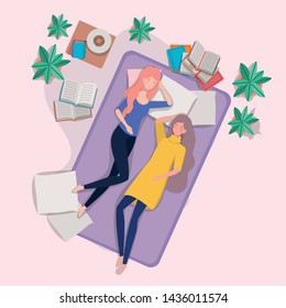 young women relaxing in mattress in the bedroom