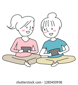 Young women sitting with crossed legs on the floor and playing games on their tablets. Girls playing game on computer tablet. Cheerful women playing games together and looking at each other's score.