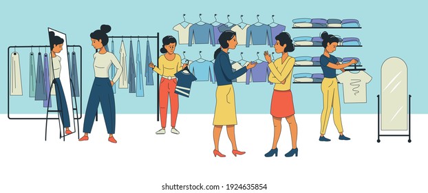 Young women talk to each other in a clothing store. People are shopping, trying on new clothes. Shopping.