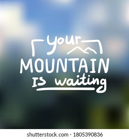 Your mountain is waiting. Hand drawn lettering on blurred background.