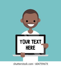 Your text here. Smiling black man pointing on the laptop screen / flat editable vector illustration, clip art