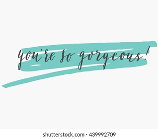 You're so gorgeous, hand lettering. Modern calligraphy. Hand written phrase on abstract background.  Abstract stroke.