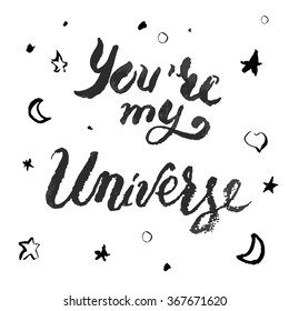 "You're my Universe". Hand drawn lettering with brush stroke texture and sketches of stars crescent moon dots and heart scattered around.