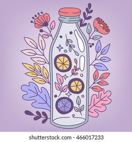 Youth elixir juice in glass bottle surrounded with flowers
