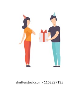 Ypung man giving gift box decorated with red ribbon bow to girl in party hat, people celebrating holidays concept, congratulations to a friend vector Illustration on a white background
