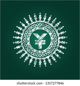 yuan icon inside chalk emblem written on a blackboard