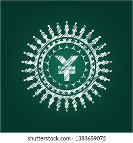 yuan icon inside chalk emblem written on a blackboard