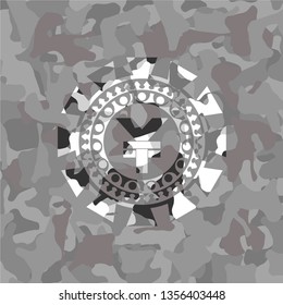yuan icon inside grey camouflaged emblem