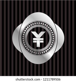 yuan icon inside silver badge or emblem