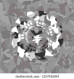 yuan icon on grey camouflaged texture