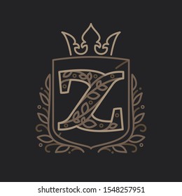 Z letter logo consisting of floral pattern letters in a heraldic shield with crown. Can be used for security, hotel, resort, restaurant, boutique, jewelry, interior and fashion industry.