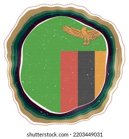 Zambia flag in frame. Badge of the country. Layered circular sign around Zambia flag. Modern vector illustration.
