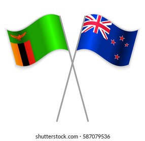 Zambian and NZ crossed flags. Zambia combined with New Zealand isolated on white. Language learning, international business or travel concept.