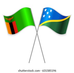 Zambian and Solomon Island crossed flags. Zambia combined with Solomon Islands isolated on white. Language learning, international business or travel concept.