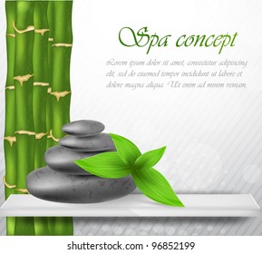 Zen stone with green bamboo and leaves