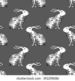 Zentangle stylized animal vector seamless pattern background with rabbits. Doodle elements might be used as decorative fabric or case print