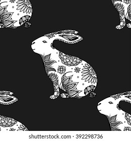 Zentangle stylized animal vector seamless pattern background with rabbits. Doodle elements might be used as decorative fabric or case print