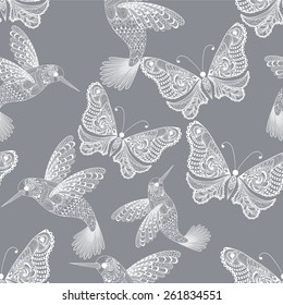 Zentangle stylized  Hummingbird and Butterfly seamless pattern. Hand Drawn vector illustration. Sketch for tattoo or makhenda. Bird collection.