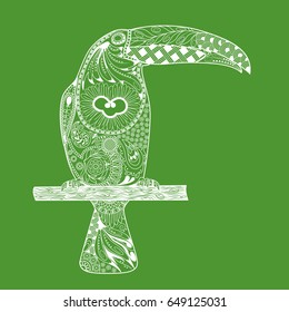 Zentangle stylized toucan. Hand Drawn doodle white bird toucan on green background