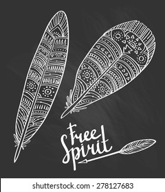 Zentangle tribal feathers set on the chalkboard. 