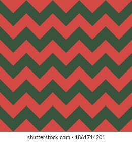 Zig zag Christmas and new year pattern. Regular chevron stripes of red and green color. Classic zigzag lines abstract geometry background. Seamless texture print. Vector illustration