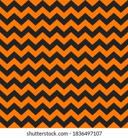 Zig zag Halloween pattern. Regular chevron stripes of orange and black color. Classic zigzag lines abstract geometry background. Seamless texture print. Vector illustration