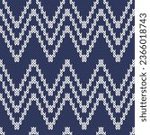 Zig zag knitted seamless pattern for sweater or socks design. White on navy background. Vector illustration