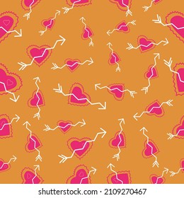 Zigzag arrows going across hearts scattered around repeat seamless pattern with orange background