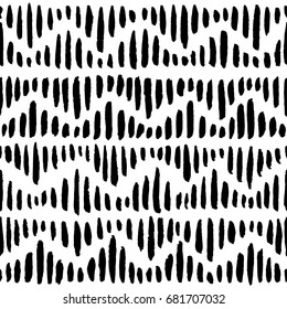 Zigzag like ornament with black brush strokes. Seamless vector pattern