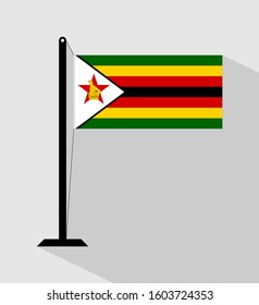 zimbabwe flag on pole, isolated on gray background