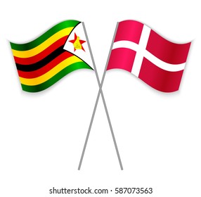 Zimbabwean and Danish crossed flags. Zimbabwe combined with Denmark isolated on white. Language learning, international business or travel concept.