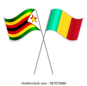 Zimbabwean and Guinean crossed flags. Zimbabwe combined with Guinea isolated on white. Language learning, international business or travel concept.