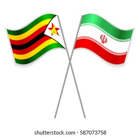 Zimbabwean and Iranian crossed flags. Zimbabwe combined with Iran isolated on white. Language learning, international business or travel concept.