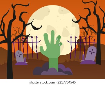 Zombie hand coming out of a grave in a creepy graveyard