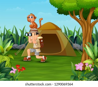 Zookeeper boy and his monkey camping in the beautiful park