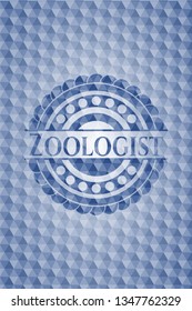 Zoologist blue badge with geometric pattern.