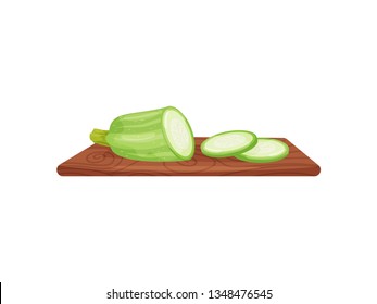 Zucchini on cutting board on white background.