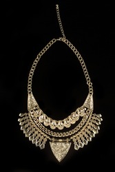 metal feminine necklace. on black  background. 