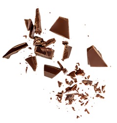 Flying Dark chocolate pieces isolated on white background.  Chocolate bar chunks, shavings and cocoa crumbs Top view. Flat lay