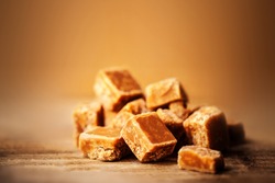Caramel. Golden Butterscotch toffee candy caramels. Toffees with copy space macro.