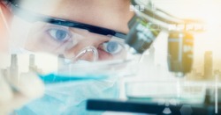 Double exposure of scientist with equipment and science experiments ,laboratory glassware containing chemical liquid for design or decorate your content,copy space,mock up.