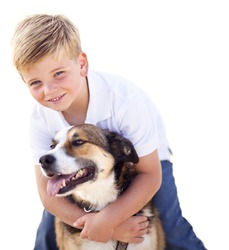Handsome Young Boy Playing with His Dog Isolated on a White Background.
