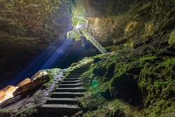 Stalbitsata cave meaning the stair, with a hole on the ceiling. Between heaven and hell concept. It is located near Lovech town in Bulgaria.