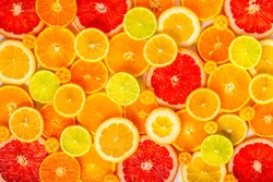 beautiful fresh sliced mixed citrus fruits like background, concept of healthy eating, dieting, top view 