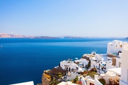Breathtaking view of Oia village with traditional white architecture on Santorini island in Greece